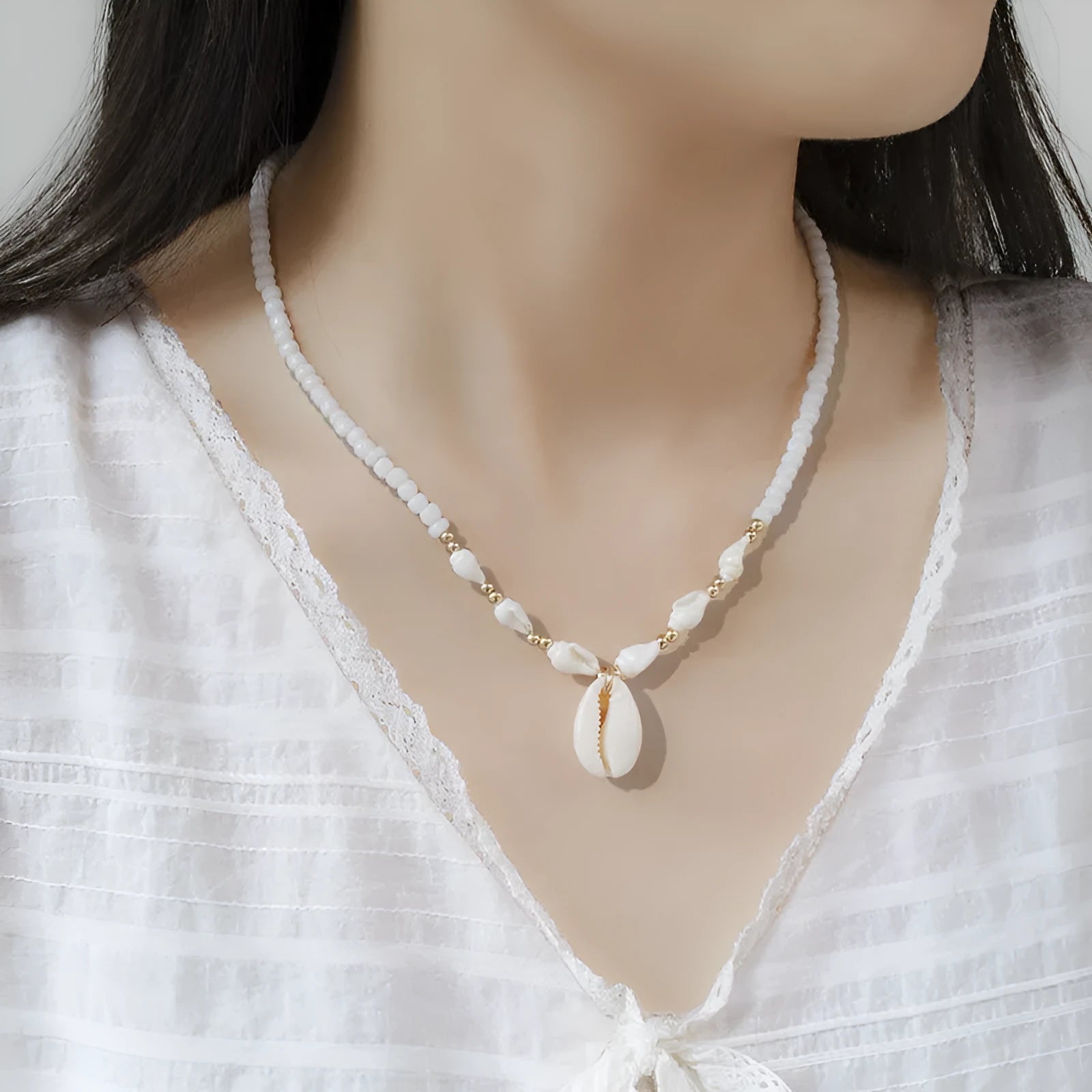 White conch shell necklace with mother-of-pearl pendant on regular chain