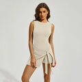 Women's solid colour tennis skirt with built-in shorts in Barbie Pink, shown on model.