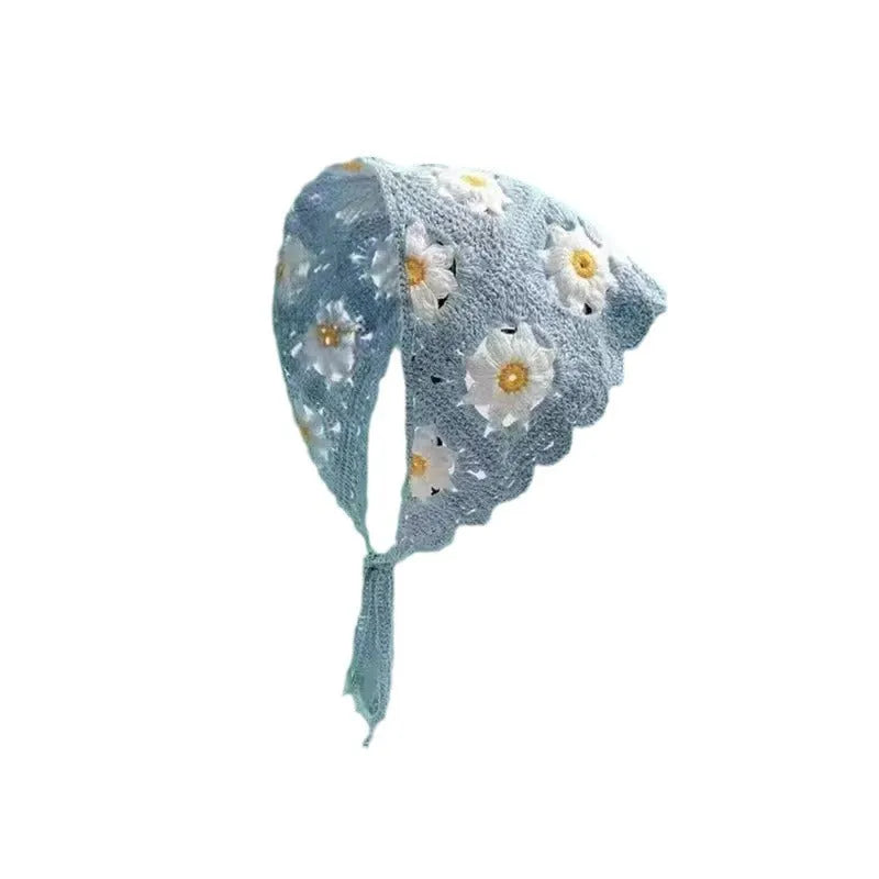 Cotton triangle headscarf with beige blue little daisy floral pattern styled on woman head
