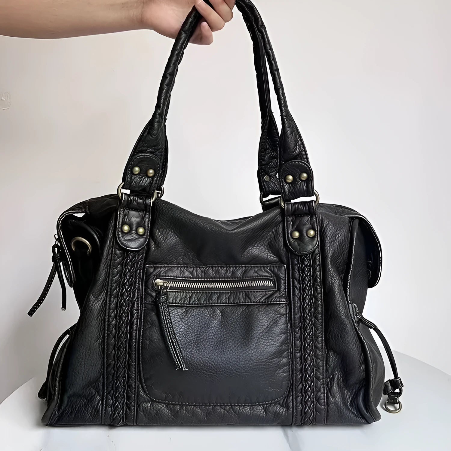 Women's brown retro motorcycle style messenger bag with woven texture and single shoulder strap