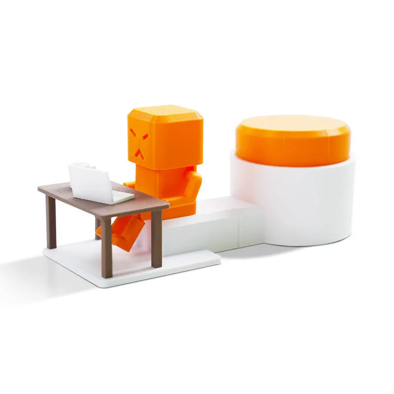 Orange plastic Take and Vent table-turning decompression toy on a desk