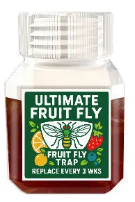 90ml bottle of SK003 fruit fly bait liquid on a kitchen counter near a fruit bowl.