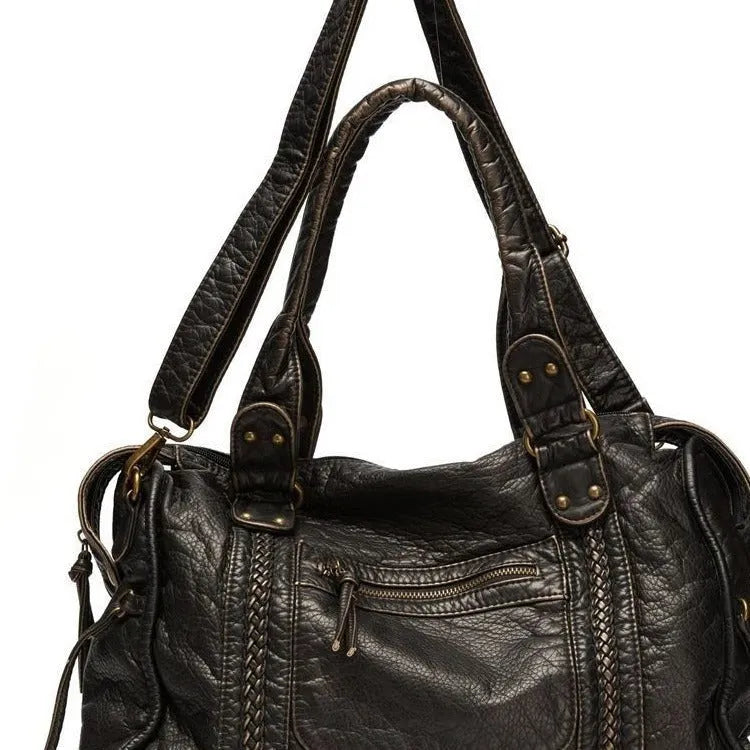 Women's brown retro motorcycle style messenger bag with woven texture and single shoulder strap