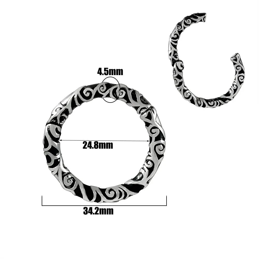 A pair of stainless steel fashion earrings with an intricate totem pattern design in a silver-toned finish.