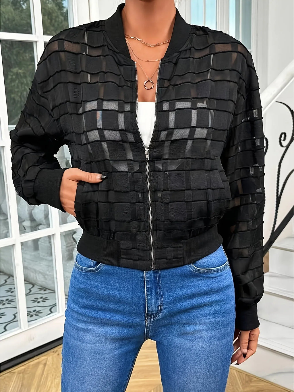 Black women's casual jacket with geometric pattern, semi-transparent fabric, and a full-length front zipper.