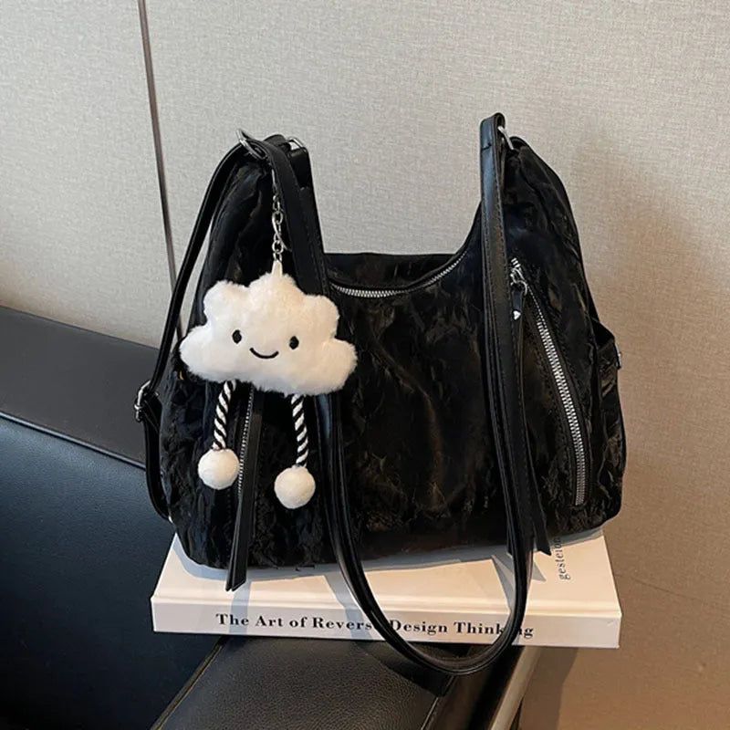 Soft black PU ladies fashion backpack with pendant, shown alongside blue, silver, and milky white colour options.