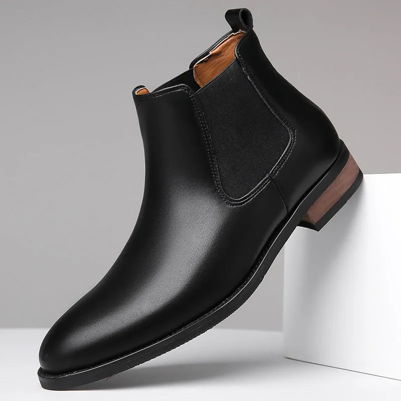 Men's black pointed Chelsea boots with low heel and rubber sole