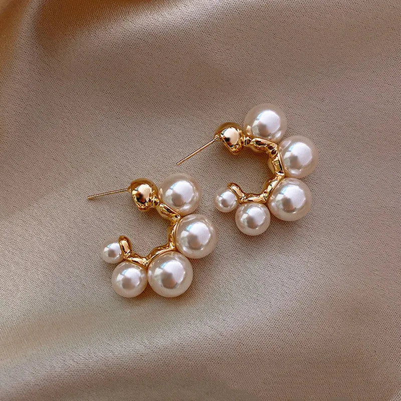 Red bell-shaped alloy drop earrings with gold-tone finish, approximately 2-3 cm length