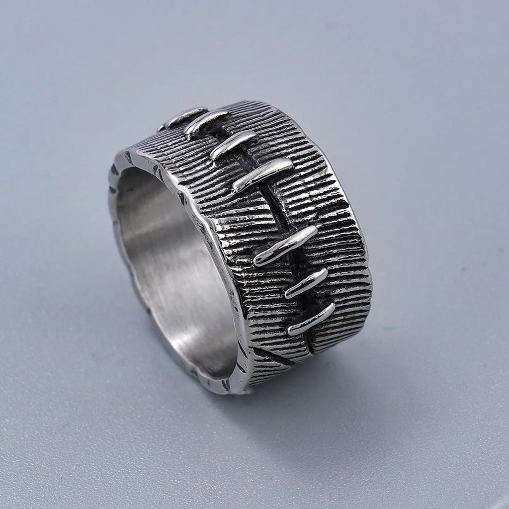 Titanium steel geometric U-shaped double ring in retro black colour, showing stitched design detail.