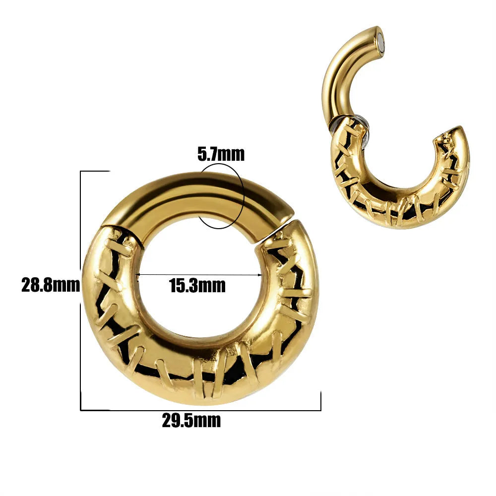 A pair of stainless steel fashion earrings with an intricate totem pattern design in a silver-toned finish.