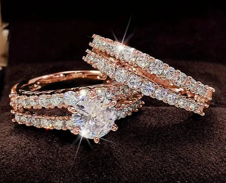 Two fully jewelled geometric round female rings in silver colour with diamond treatment surfaces