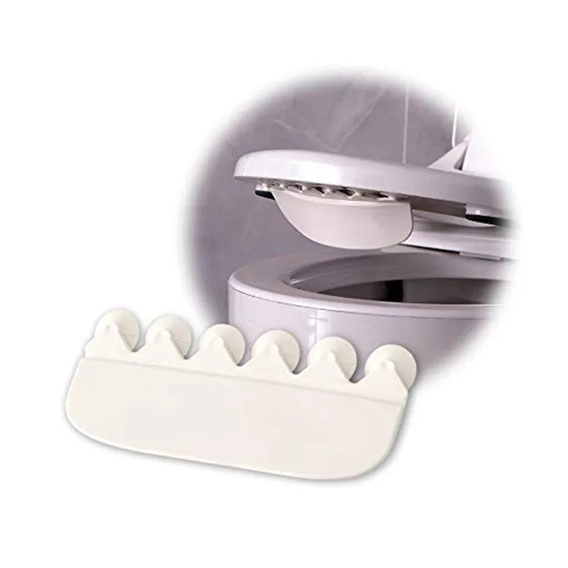 White PVC toilet urine splash guard board for boys potty training on a toilet seat.
