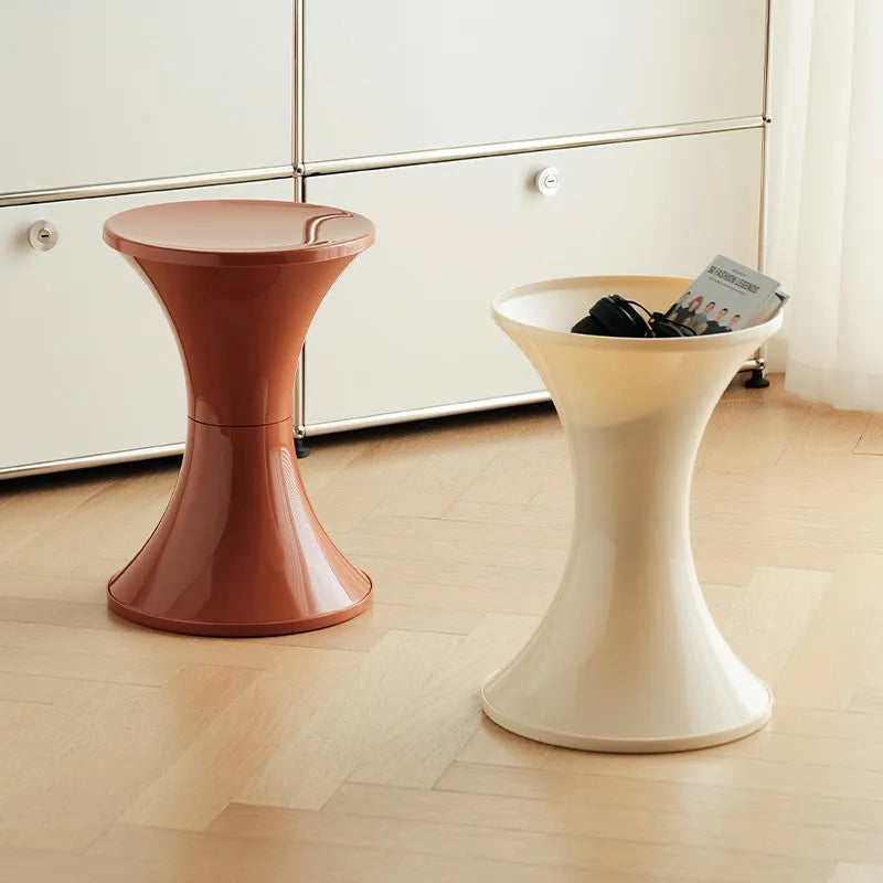 Plastic hourglass-style shoe changing stool shown in one of five colour options.