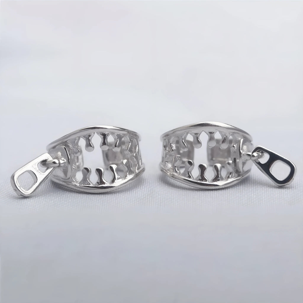 Copper geometric bone clip earrings with linear design on a white background.