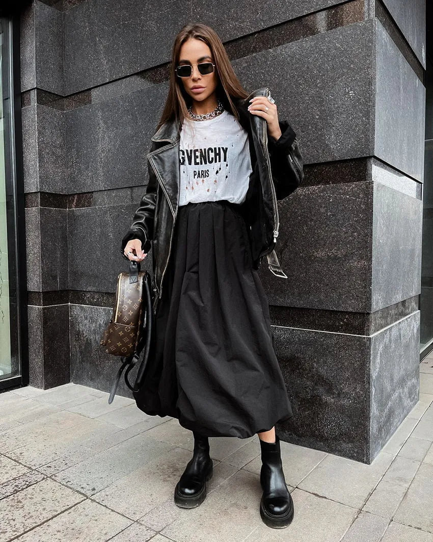 Women's solid colour cotton long skirt in black on a hanger.