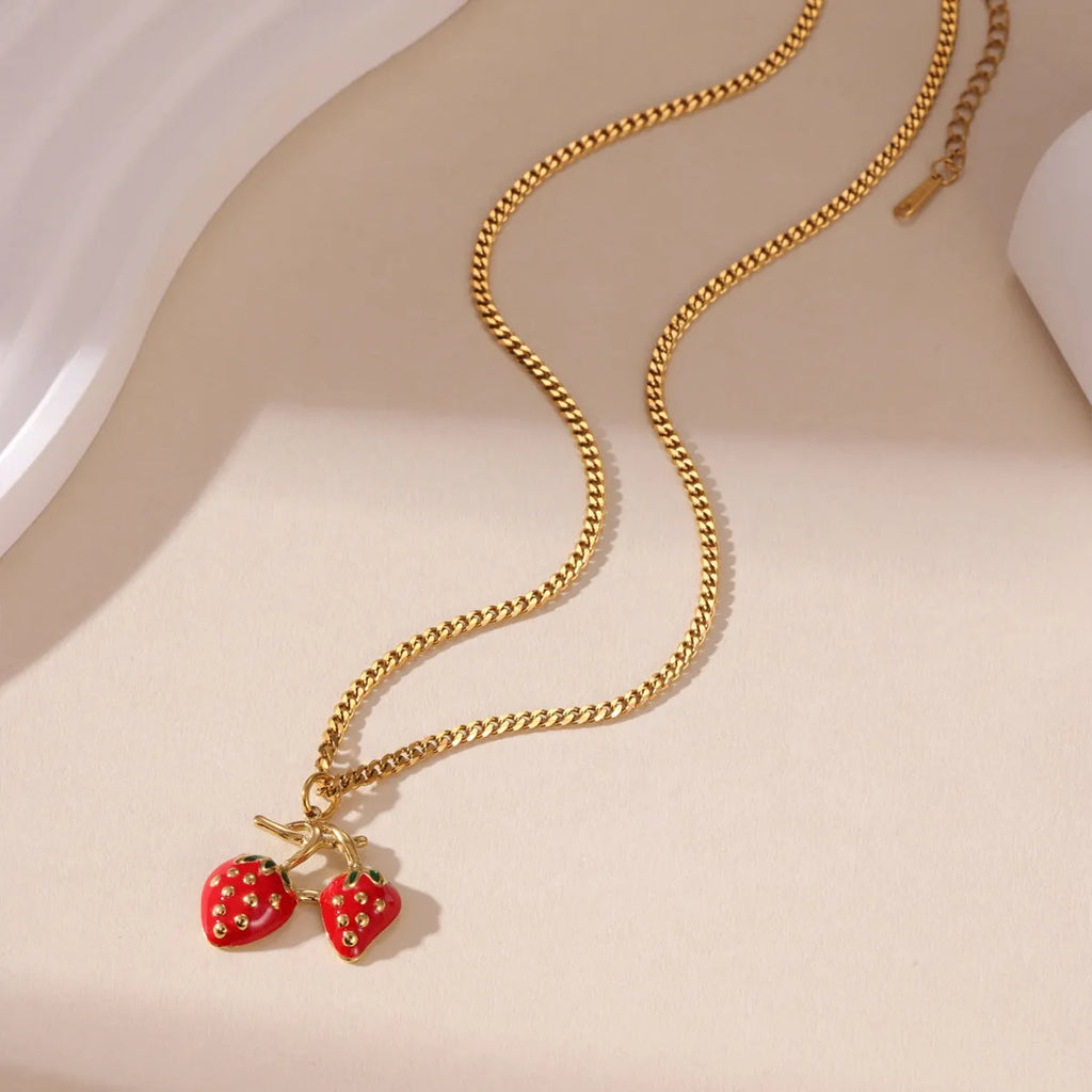 Stainless steel strawberry pendant necklace on alloy chain in red or white powder gradient colour