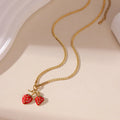 Stainless steel strawberry pendant necklace on alloy chain in red or white powder gradient colour