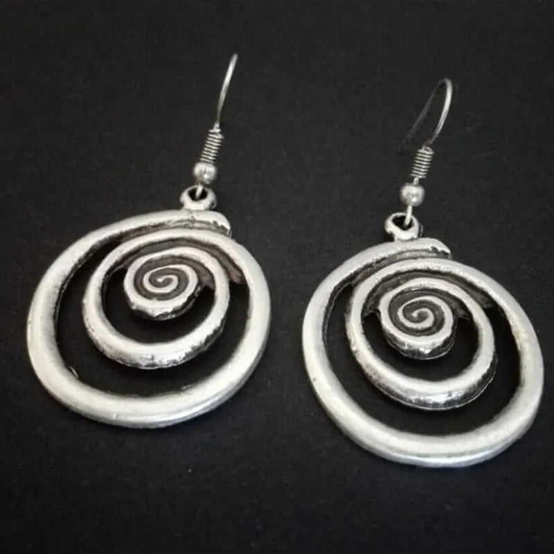Silver alloy geometric spiral earrings with distressed finish measuring 2.6cm wide by 5cm long