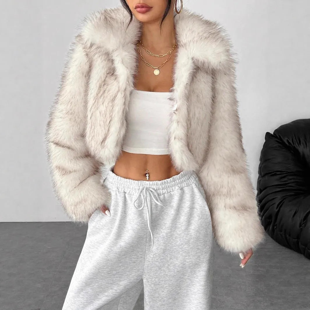 Black artificial fur coat with a large fur collar, shown in a short length style.