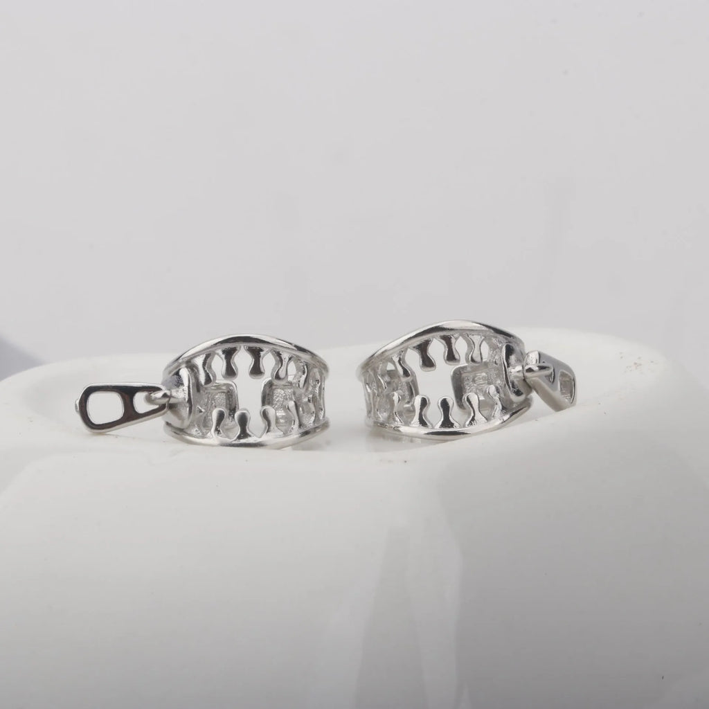 Copper geometric bone clip earrings with linear design on a white background.