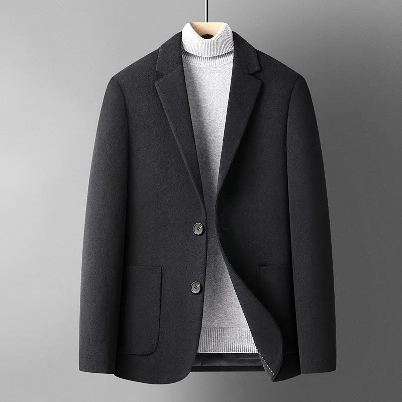 A man wearing a slim-fit grey wool blend suit jacket for autumn and winter leisure wear.
