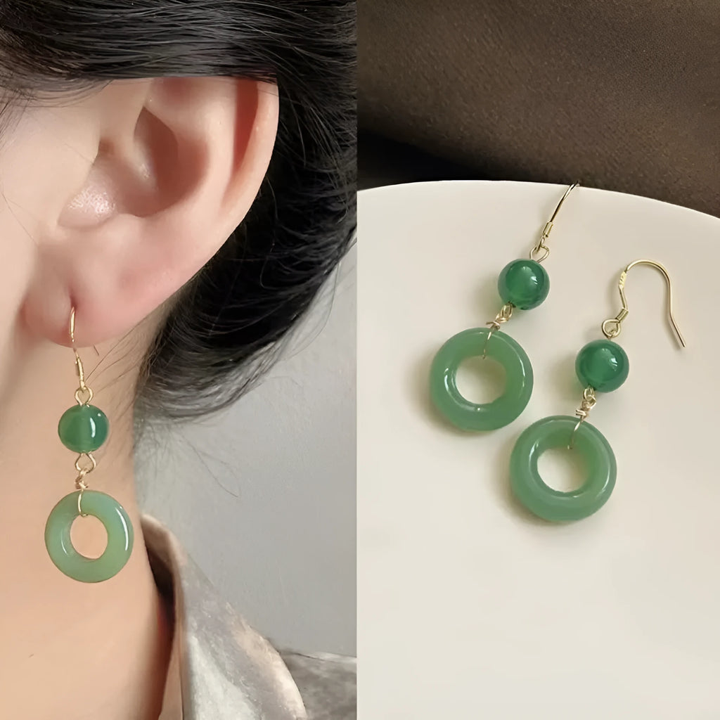Green geometric peace buckle earrings with 14K gold plating on a zinc alloy base.