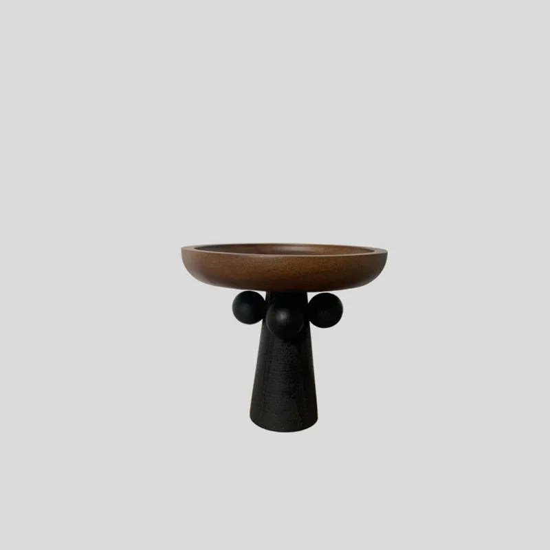 Nordic style high-legged round wooden tray on a table.