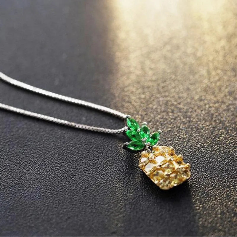 Silver plated women's necklace with a geometric pineapple diamond pendant charm.
