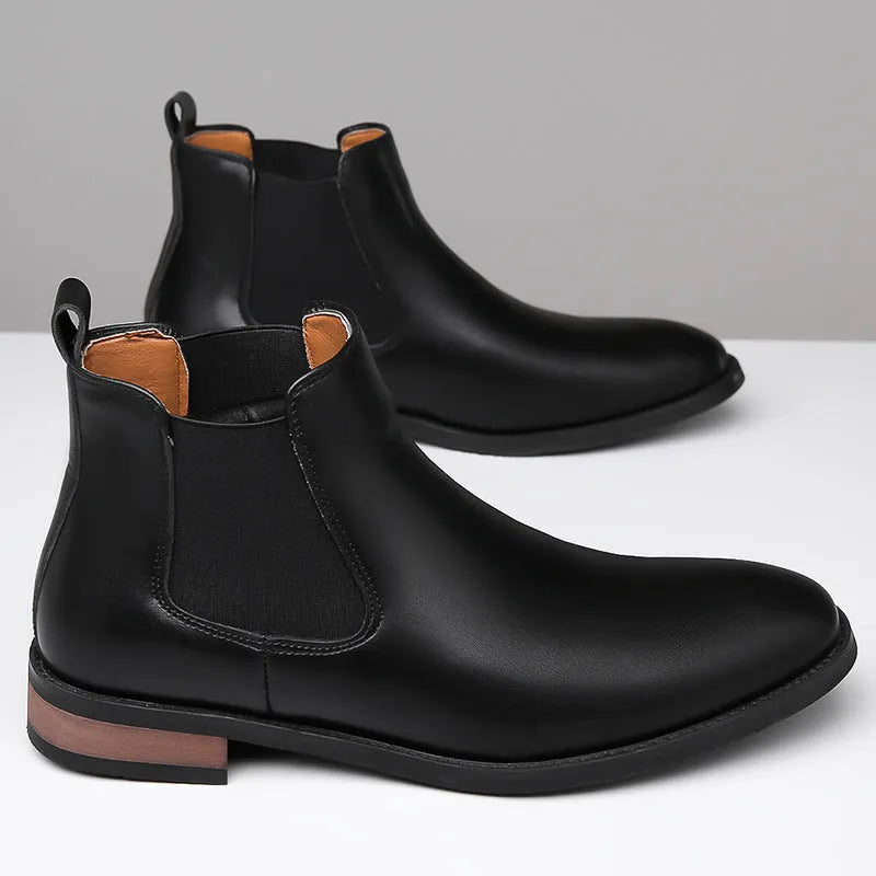 Men's black pointed Chelsea boots with low heel and rubber sole