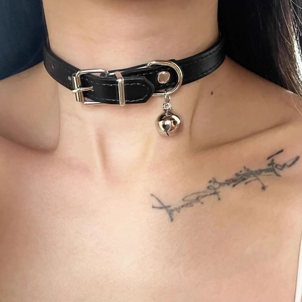 Black adjustable dog collar with choice of cat paw, bone, or LD leather charm on a white background.