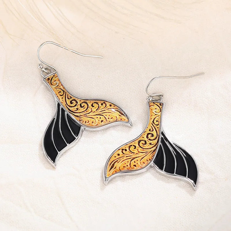 Women's white gold colour fishtail earrings with retro whale design elements