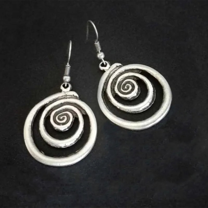 Silver alloy geometric spiral earrings with distressed finish measuring 2.6cm wide by 5cm long