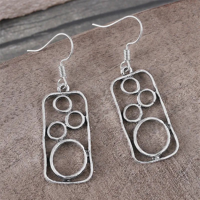 Geometric round ring earrings with irregular square shapes in antique silver finish