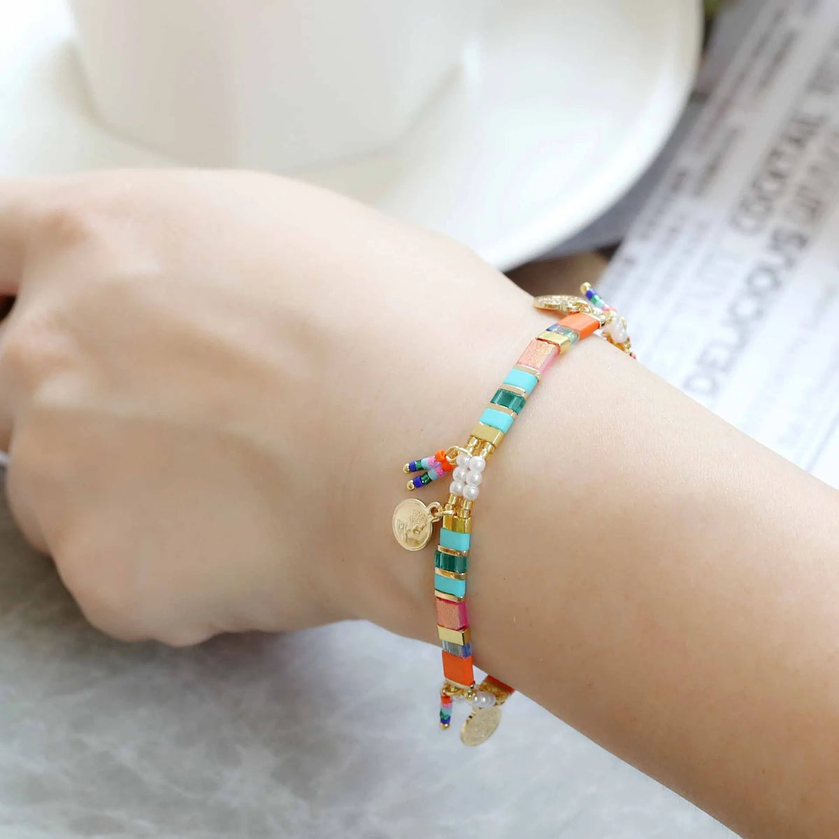 Handmade women's glass coloured beaded bracelet with imitation pearls in a European and American design style.