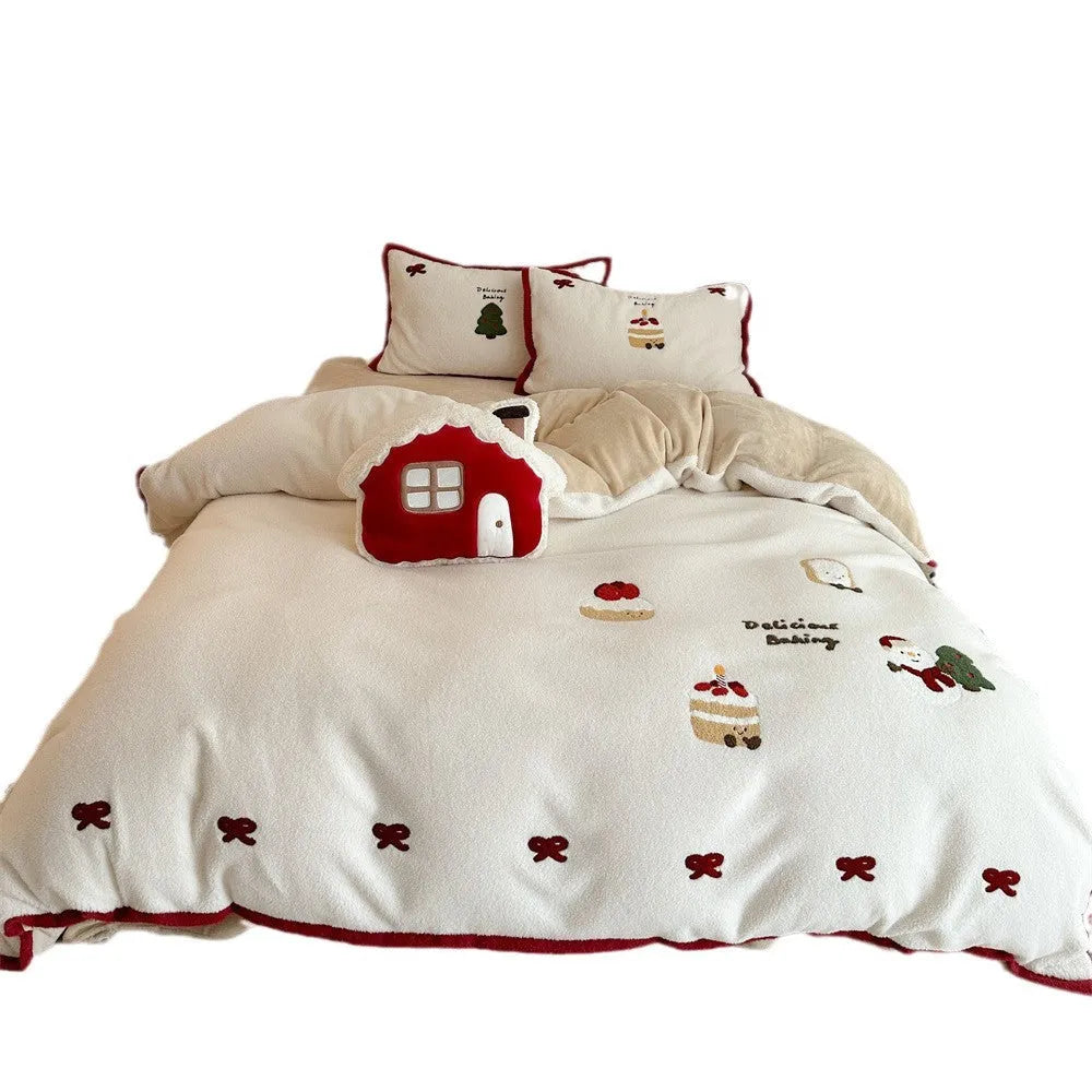 Winter Christmas cartoon snowman print bedding four-piece set on a single bed, showing duvet cover, pillowcases, and sheet.