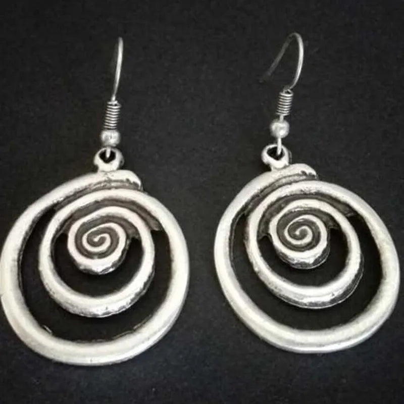Silver alloy geometric spiral earrings with distressed finish measuring 2.6cm wide by 5cm long