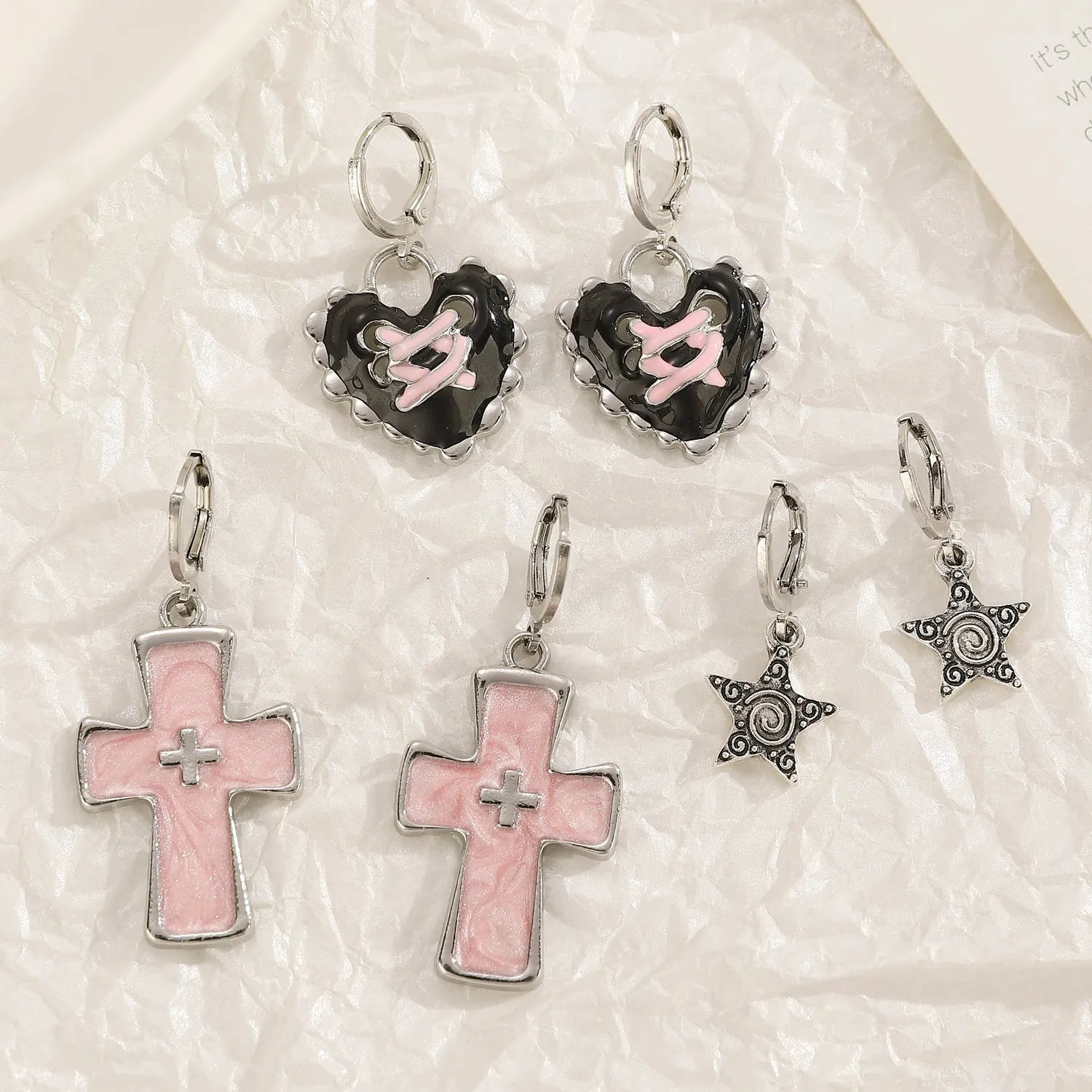 Women's cross crystal earrings with dripping oil treatment in white, black, and silver colour variations