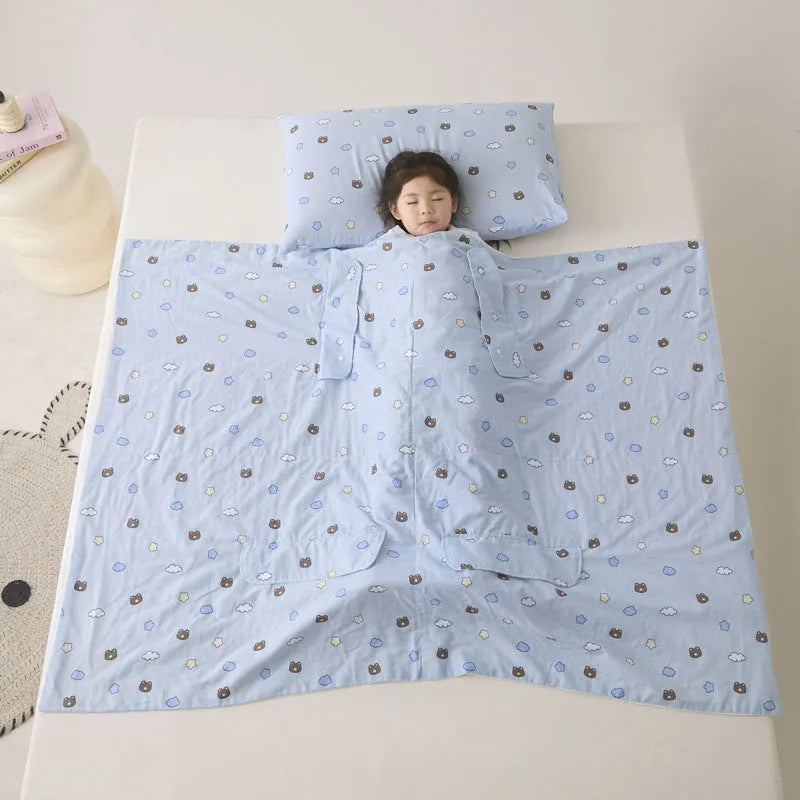 Colourful patterned anti-kick sleeping bag blanket folded to show size and design.