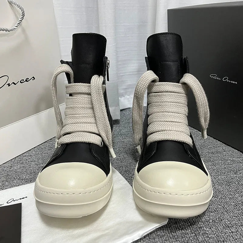 Men's black high-top leather sneakers with side zip, platform sole, and visible stitching details.