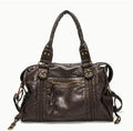 Women's brown retro motorcycle style messenger bag with woven texture and single shoulder strap