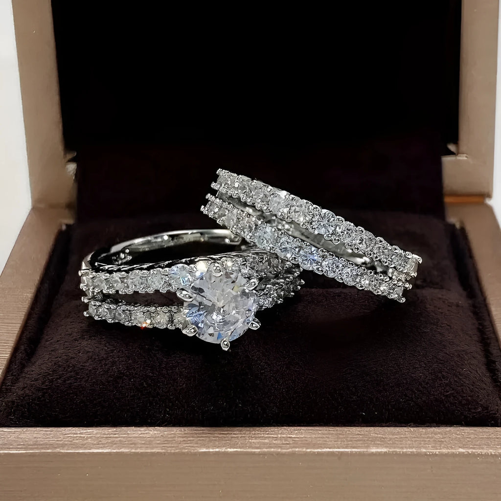 Two fully jewelled geometric round female rings in silver colour with diamond treatment surfaces