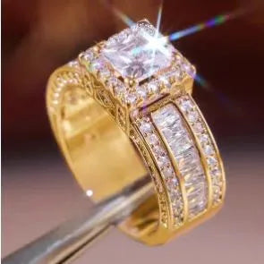 Geometric alloy women's ring in gold and white electroplated finishes on a size chart.