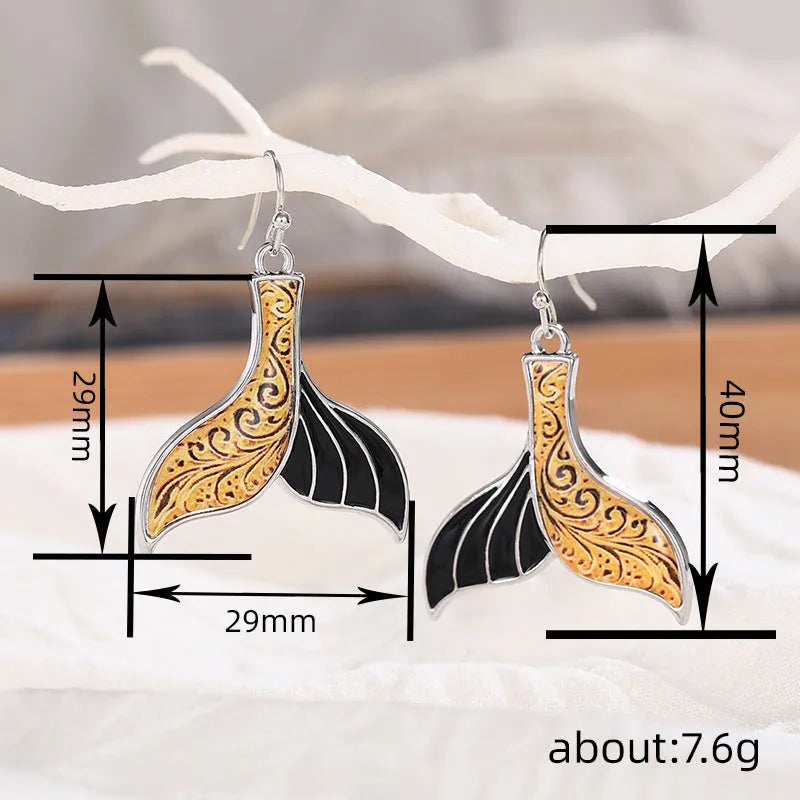 Women's white gold colour fishtail earrings with retro whale design elements