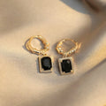 Pair of black zircon and copper geometric quadrilateral earrings in retro French Court style.