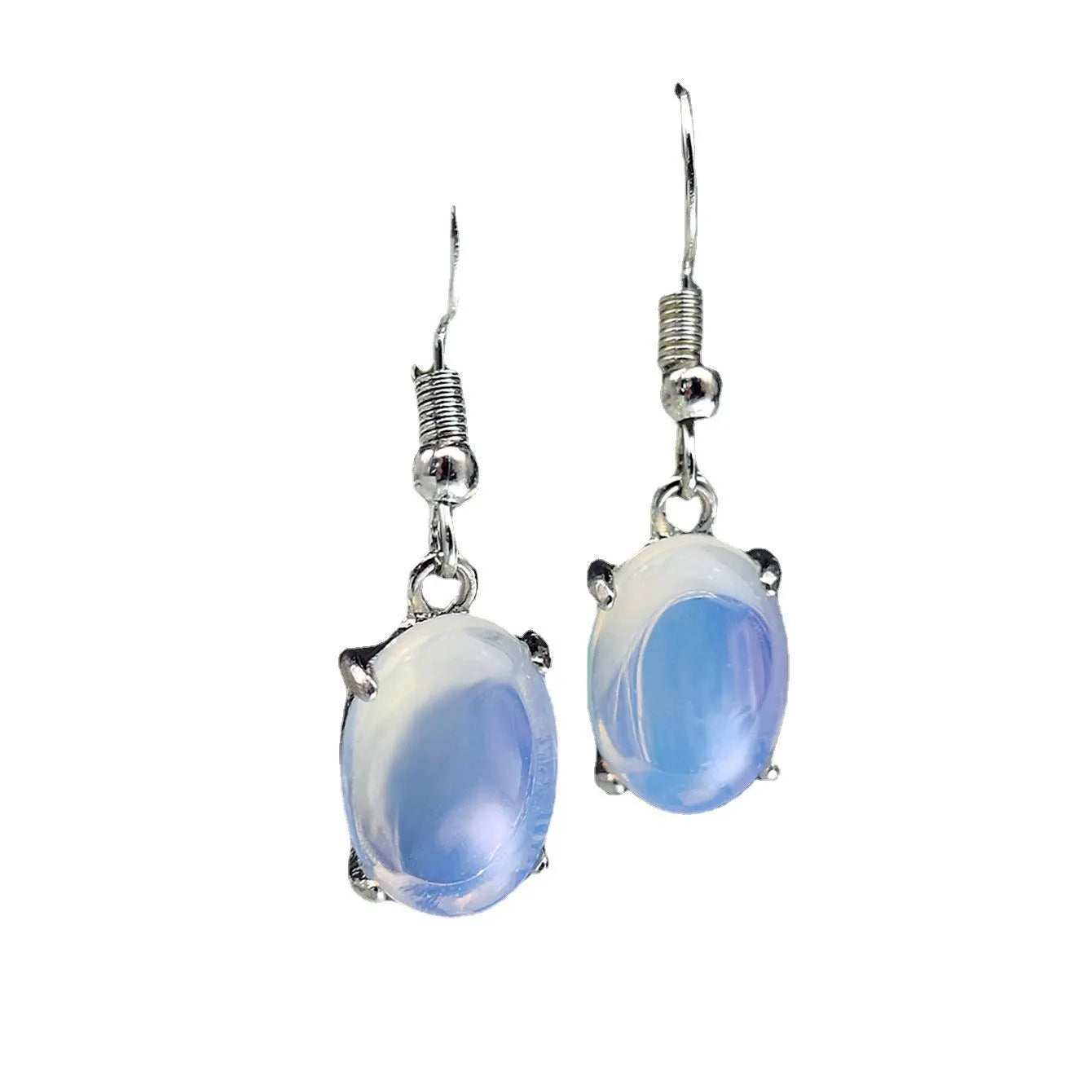 A pair of retro-style opal drop earrings in moonlight white with a cross detail and ellipse shapes.