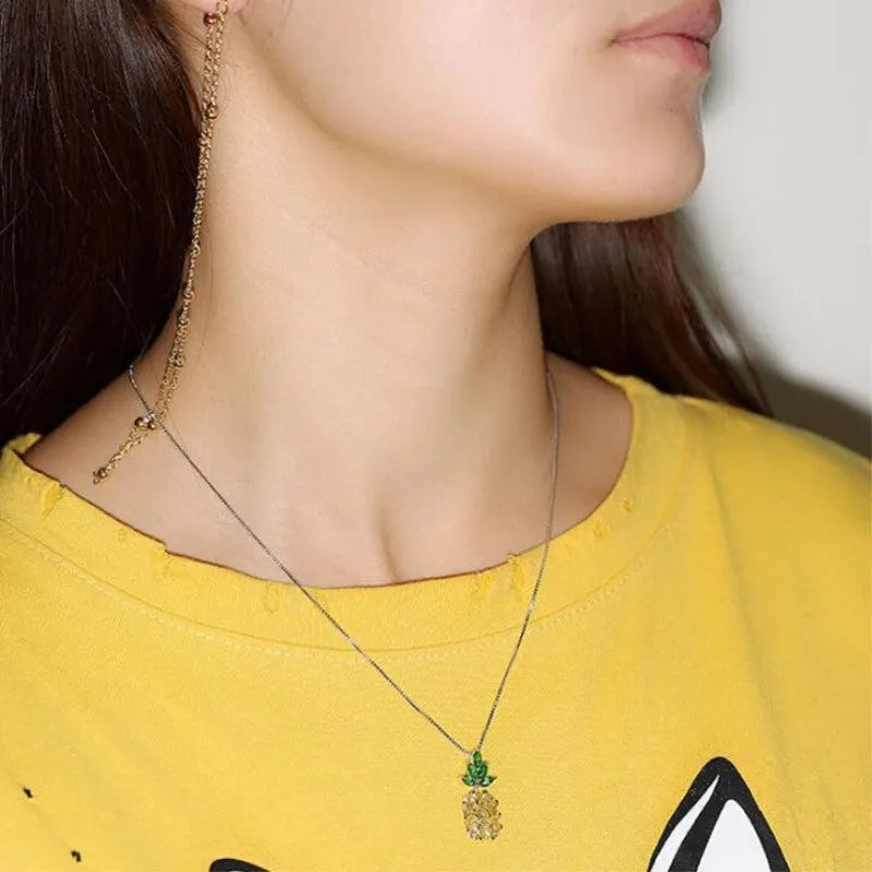 Silver plated women's necklace with a geometric pineapple diamond pendant charm.