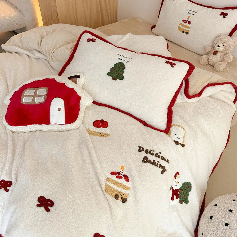 Winter Christmas cartoon snowman print bedding four-piece set on a single bed, showing duvet cover, pillowcases, and sheet.