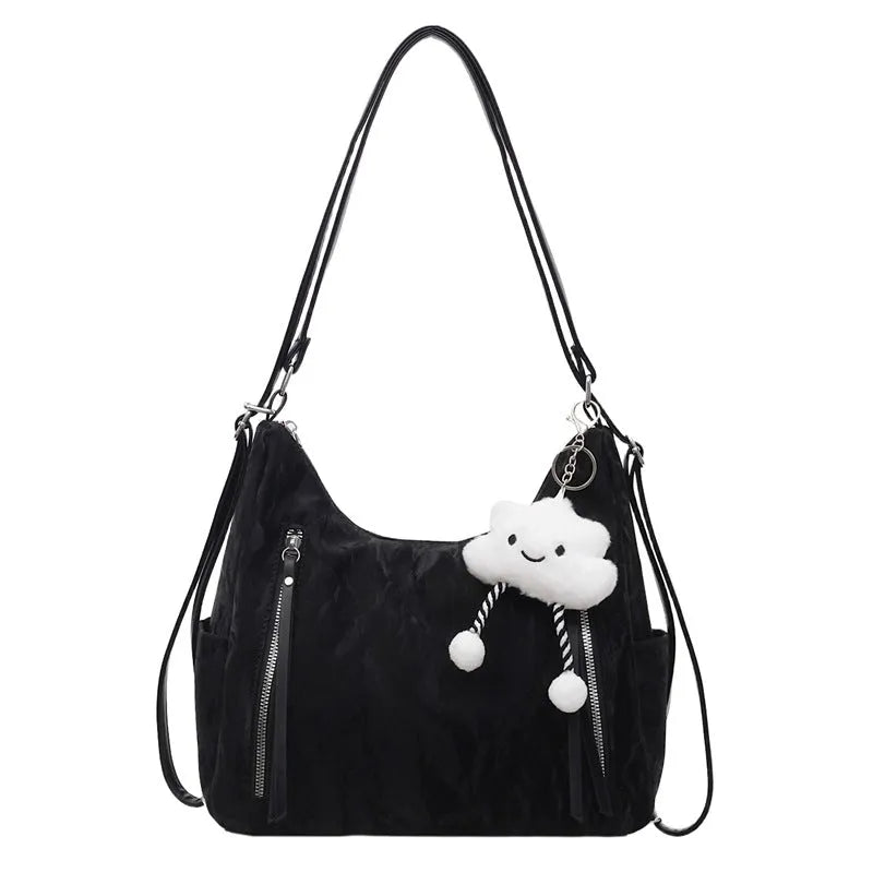 Soft black PU ladies fashion backpack with pendant, shown alongside blue, silver, and milky white colour options.