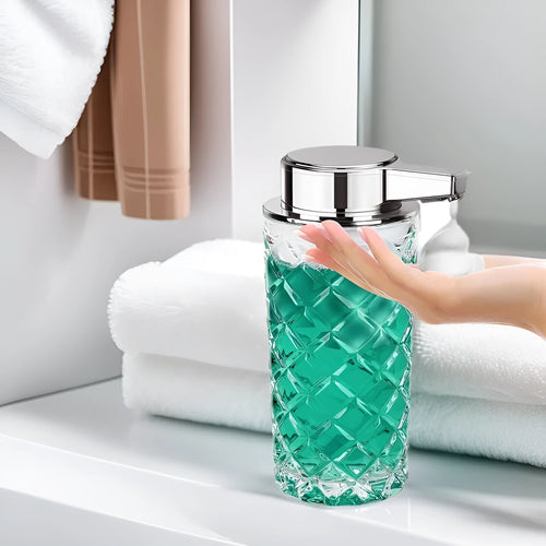 Silver automatic sensor soap dispenser with USB-C charging port on a bathroom counter.