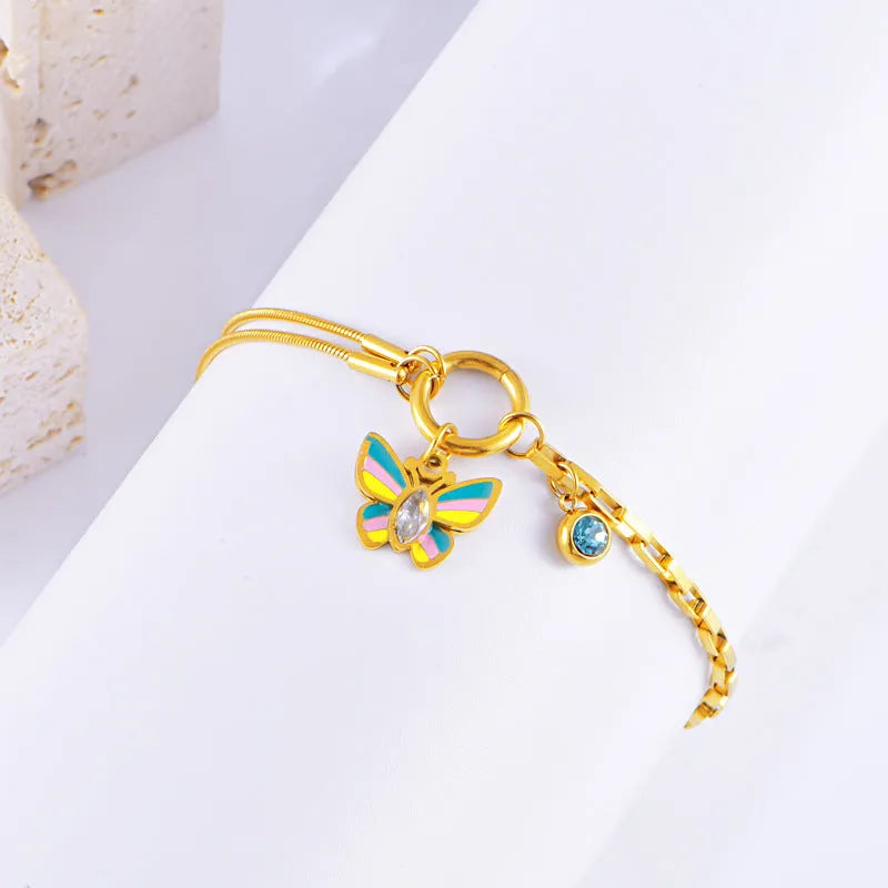 Gold titanium steel epoxy butterfly necklace and bracelet set with snake bones chain.